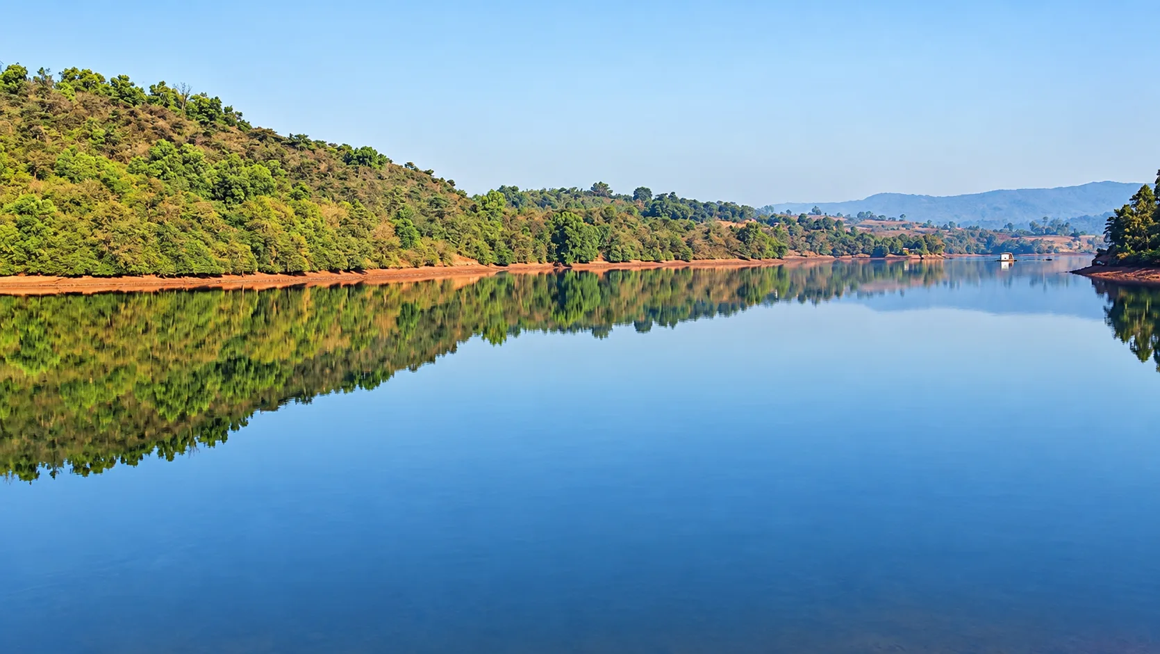 Hill shadow reflected on the lake at Viva Andur