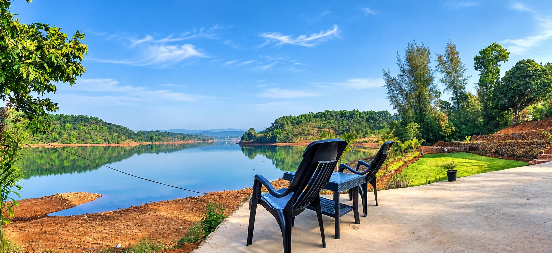 Seating chairs on the deck overlooking the lake at Viva Andur